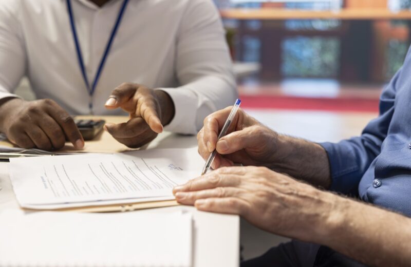 mature-person-signing-pension-plan-contract-retirement-package