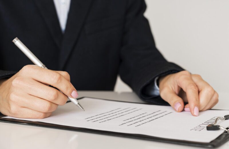 person-signing-certificate-front-view